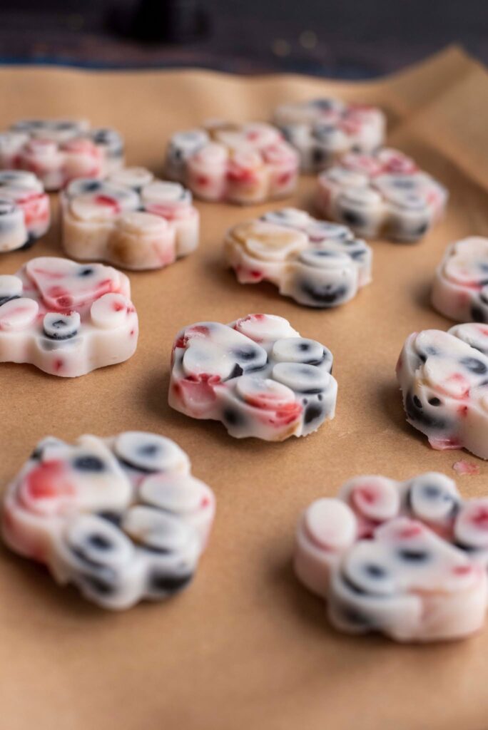 frozen yogurt paw print dog treats on a baking sheet