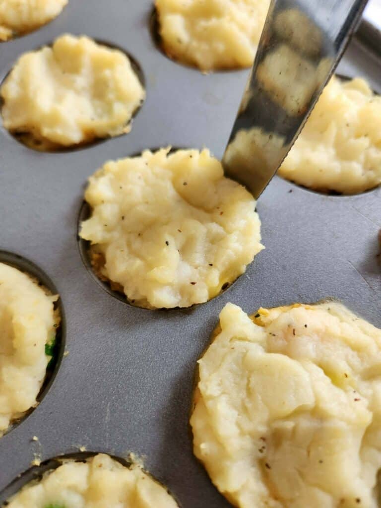 Mini turkey pot pie bites for dogs in a mini muffin pan