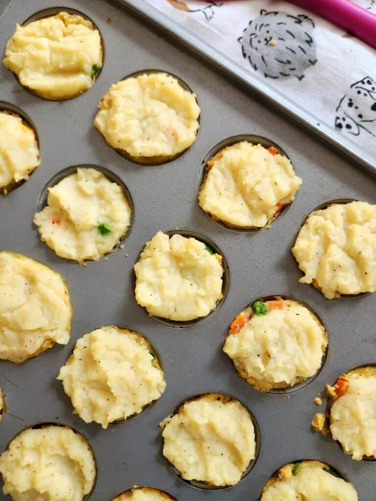 Mini turkey pot pie bites for dogs in a mini muffin pan