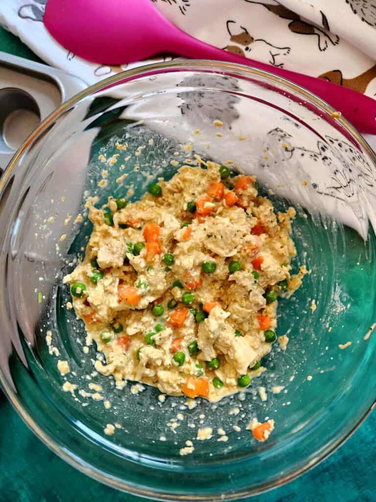 ingredients for mini pup pot pies mixed in a bowl