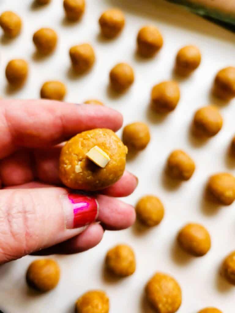 homemade dog pill pocket being wrapped around medication to hide pill