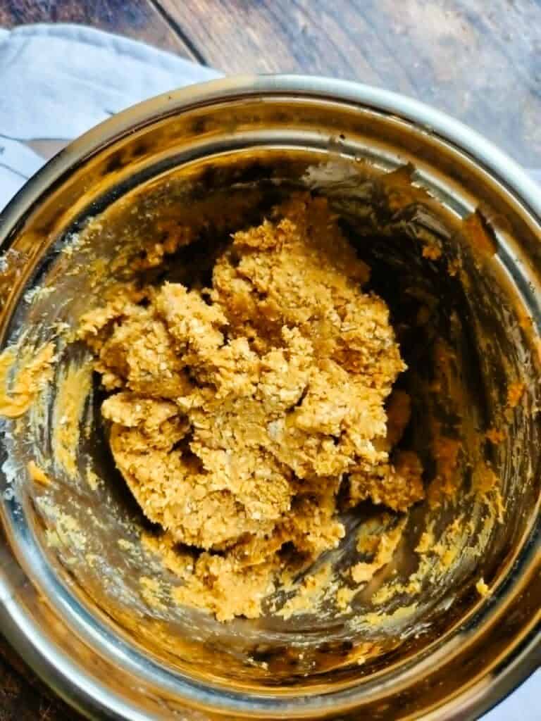homemade dog treat dough being mixed in bowl for easy pill pockets recipe