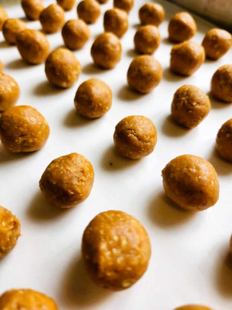 finished peanut butter dog pill pockets arranged on parchment paper ready to serve