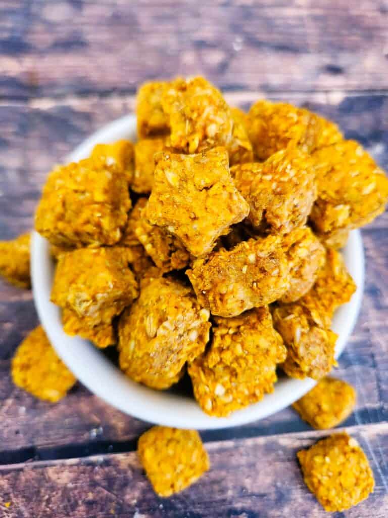 Finished pumpkin chamomile calming chews for dogs stacked and ready to serve as homemade anxiety treats