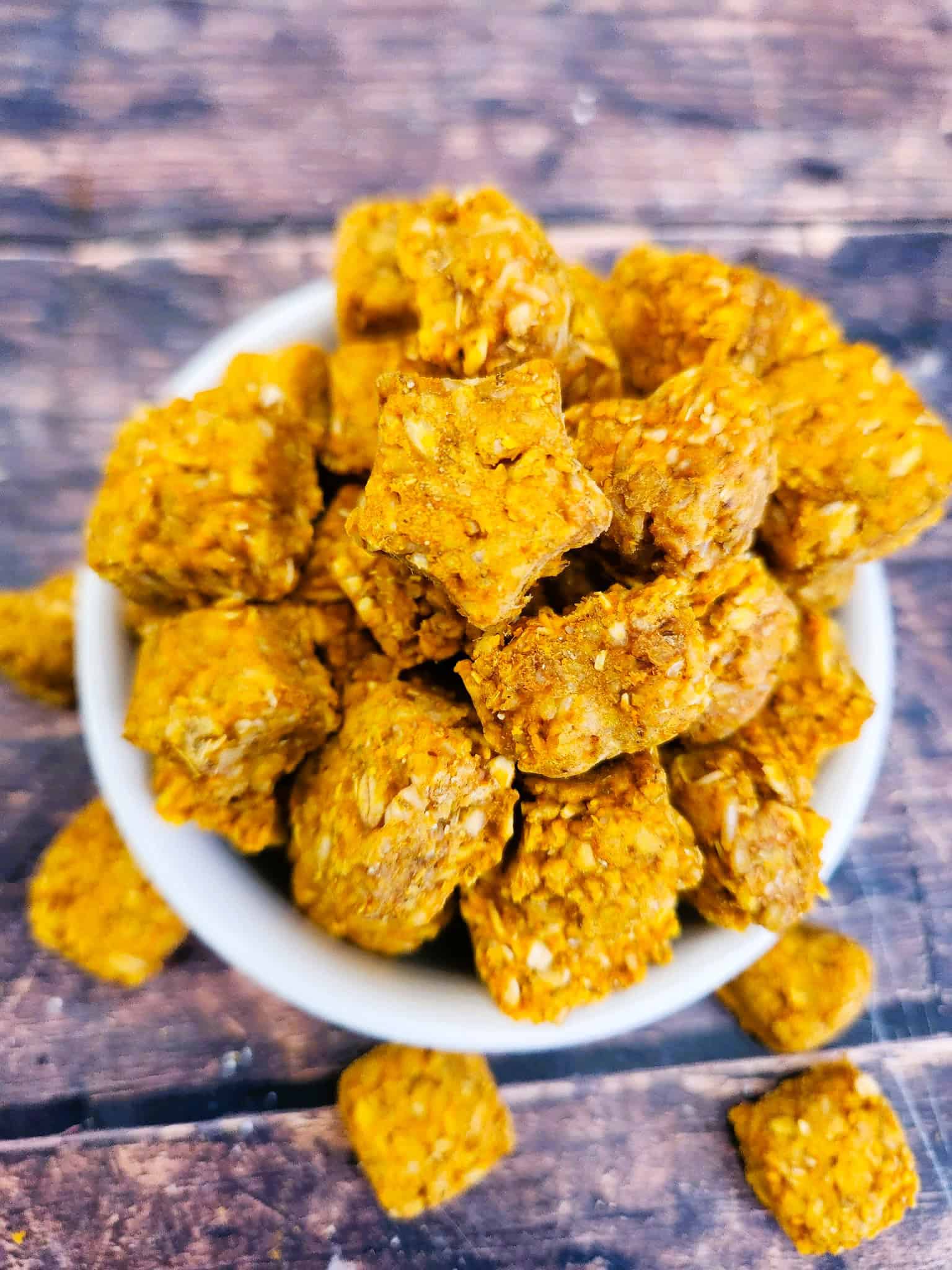 Finished pumpkin chamomile calming chews for dogs stacked and ready to serve as homemade anxiety treats