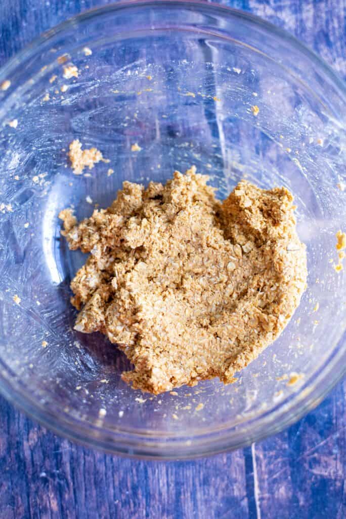 Stirring pumpkin chamomile dog treat dough until thick and well combined